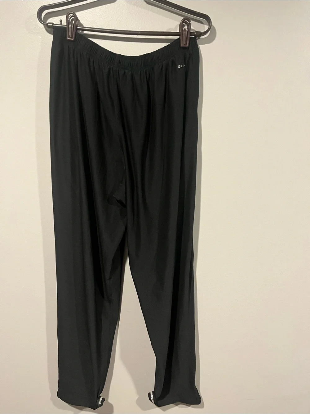 Nike Black Track Pants with White Swoosh and Ankle Zips